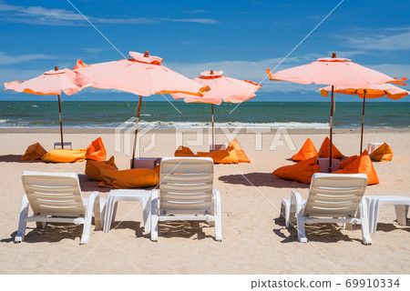 summer beach with chair. relax seat, parasol 69910334