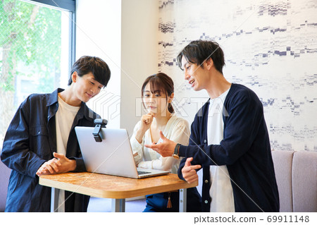 Business person surrounding a personal computer Business person surrounding a personal computer 69911148