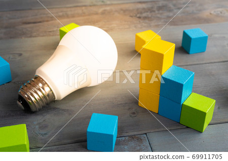Electricity bill graph light bulb Electricity bill graph light bulb 69911705