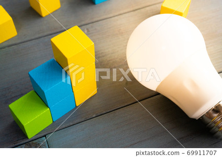 Electricity bill graph light bulb 69911707