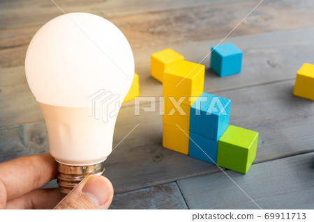 Electricity bill graph light bulb 69911713