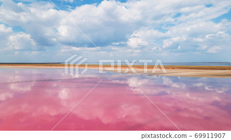 Aerial view of colorful pink salt lake and clouds reflection 69911907