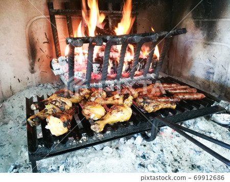Grilled meat on fireplace 69912686