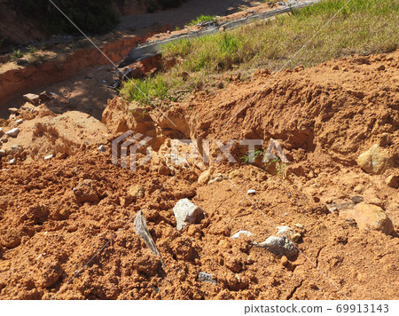 Erosion at ground and slopes is caused by rainfall. The soil structure is weak and there is a landslide. Safety measure has been taken in some area. Erosion at ground and slopes is caused by rainfall. The soil structure is weak and there is a landslide. Safety measure has been taken in some area. 69913143
