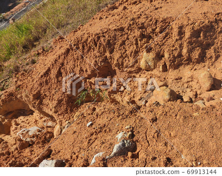 Erosion at ground and slopes is caused by rainfall. The soil structure is weak and there is a landslide. Safety measure has been taken in some area. Erosion at ground and slopes is caused by rainfall. The soil structure is weak and there is a landslide. Safety measure has been taken in some area. 69913144