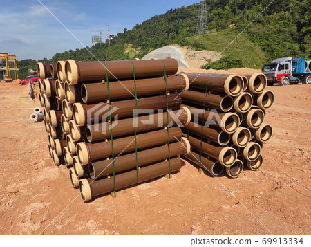 SEREMBAN, MALAYSIA -MARCH 2, 2020: Vitrified clay pipe stacked at the construction site. Commonly used as the sewerage underground pipe. It is lasting and heavy-duty.  69913334