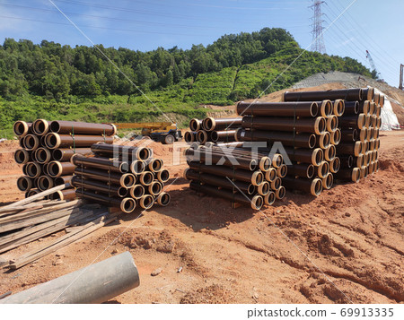 SEREMBAN, MALAYSIA -MARCH 2, 2020: Vitrified clay pipe stacked at the construction site. Commonly used as the sewerage underground pipe. It is lasting and heavy-duty.  69913335