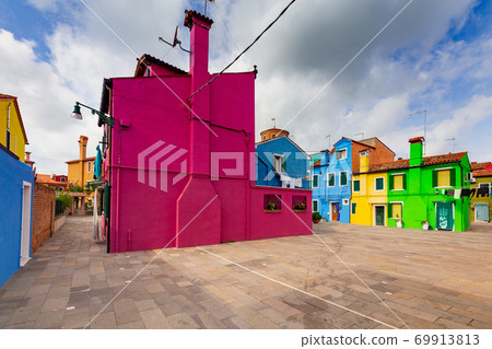 Facades of traditional old houses on the island of Burano. 69913813