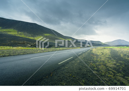 Icelandic landscape with asphalt road Icelandic landscape with asphalt road 69914701