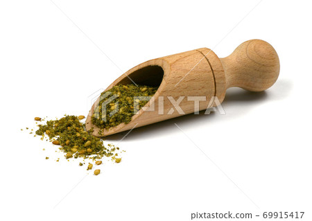 Za'atar (zatar), blend of herbs, sesame seeds and salt in pile on white background. 69915417