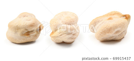 Chickpeas isolated on white background. Close-up shot. Chickpeas isolated on white background. Close-up shot. 69915437