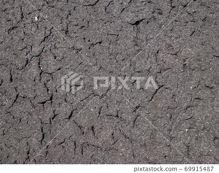 Old asphalt road. The texture detail of black tarmac road 69915487