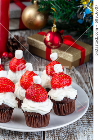 Strawberry and chocolate muffin Santa, Christmas menu for kids or party, vertical 69916007