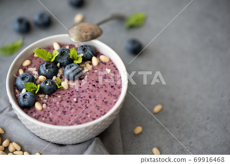 blueberry smoothie with mint and pine nuts blueberry smoothie with mint and pine nuts 69916468