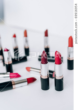 Lipstick in different colors on a light background 69916954