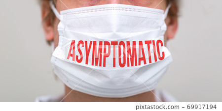 Asymptomatic theme with person wearing a protective face mask Asymptomatic theme with person wearing a protective face mask 69917194