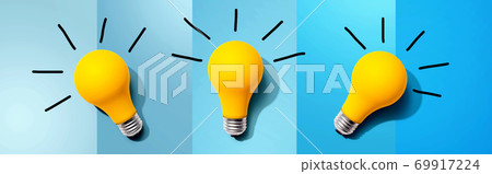 Three yellow light bulbs 69917224