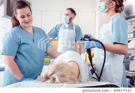 Patient and doctor in hospital during colonoscopy 69917411