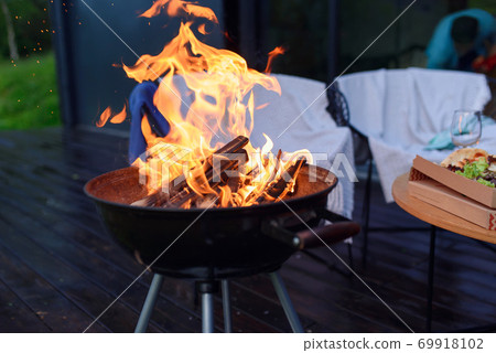 Bbq grill flame, hot burning grill outdoors cooking food. Grill burning fire for barbecue cooking outdoors. 69918102