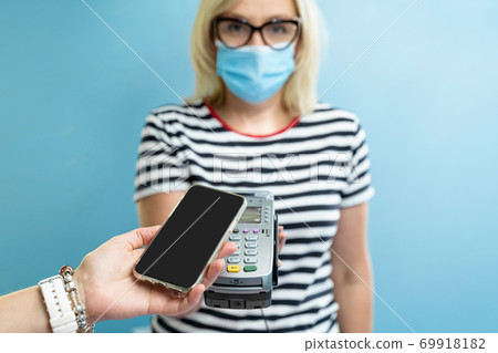 Caucasian female business owner get payment with contactless smartphone pay. pandemic smart banking 69918182