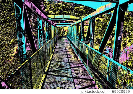 Iron footbridge over small river 69920939