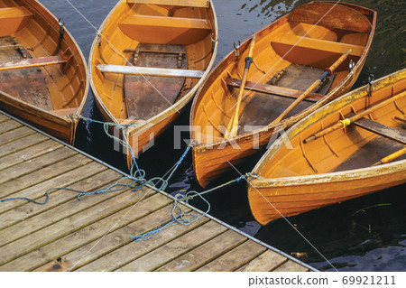 Several wooden boats on a pier in Cambridge 69921211