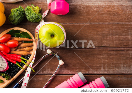 fruit and vegetable in heart plate, shoes, sports equipment and doctor stethoscope fruit and vegetable in heart plate, shoes, sports equipment and doctor stethoscope 69921772