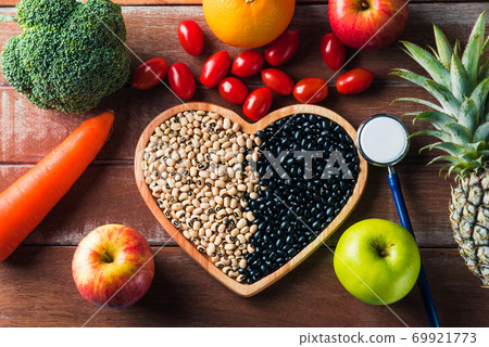 fruit and vegetable in heart plate and doctor stethoscope fruit and vegetable in heart plate and doctor stethoscope 69921773