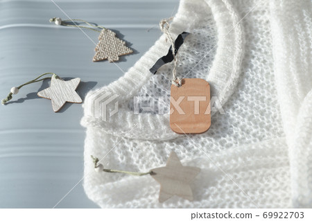 white knitted pullover with wooden tag mockup white knitted pullover with wooden tag mockup 69922703