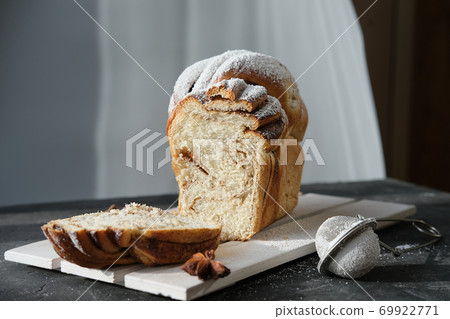 artisan cinnamon swirl bread on wooden rack 69922771