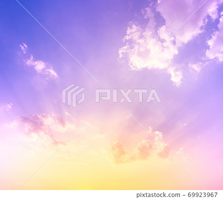 sky and clouds nature background,yellow and orange sunset light on purple blue sky with soft clouds sky and clouds nature background,yellow and orange sunset light on purple blue sky with soft clouds 69923967