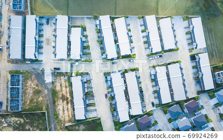 Aerial view of housing subdivision or housing development. 69924269