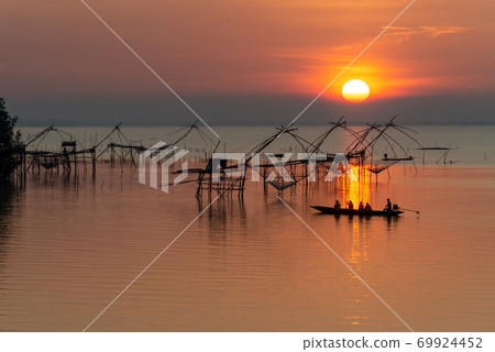 Landmark of giant fishing gears at Pakpra with beautiful sunrise. 69924452