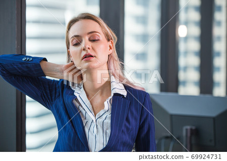 Business worker feeling tired frustrated stressed from hard work and massage necks to relieve pain Business worker feeling tired frustrated stressed from hard work and massage necks to relieve pain 69924731
