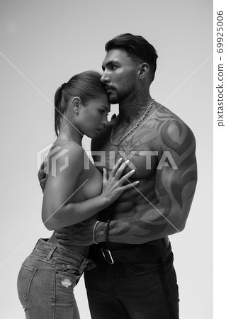 Sexy young couple in studio 69925006