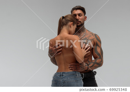 Sexy couple in panties hugging each other Sexy couple in panties hugging each other 69925348