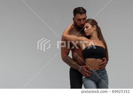 Sexy couple in panties hugging each other Sexy couple in panties hugging each other 69925352