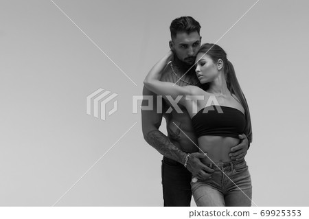 Sexy young couple in studio Sexy young couple in studio 69925353