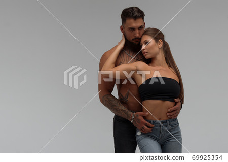 Sexy couple in panties hugging each other Sexy couple in panties hugging each other 69925354