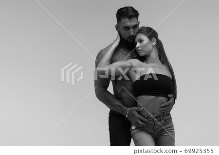 Sexy young couple in studio Sexy young couple in studio 69925355