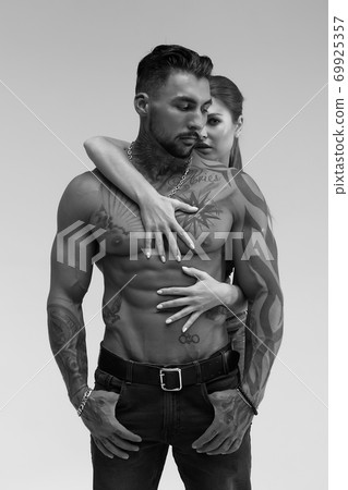 Seductive couple looking at camera 69925357