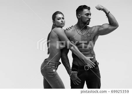 Sexy young couple in studio Sexy young couple in studio 69925359