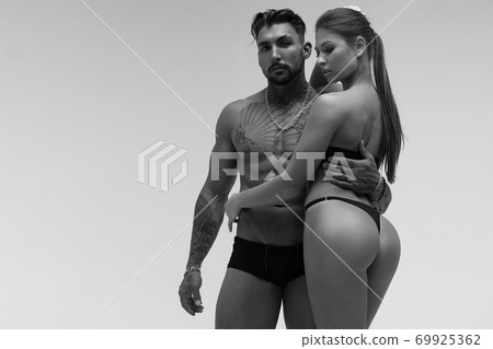 Sexy young couple in studio Sexy young couple in studio 69925362
