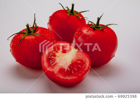Three wet tomatoes plus one cut 69925398