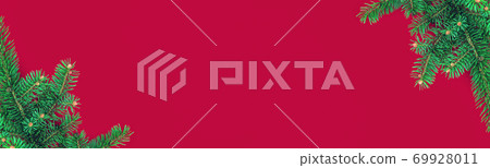 Christmas banner with border of green fir branches on red background Christmas banner with border of green fir branches on red background 69928011