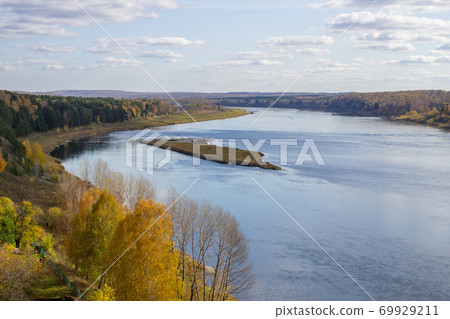Beautiful, wide river autumn among the woods. Beautiful, wide river autumn among the woods. 69929211