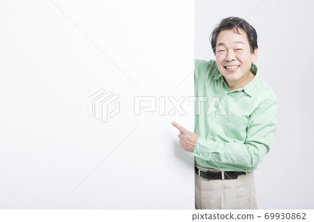 A man with a message board 69930862