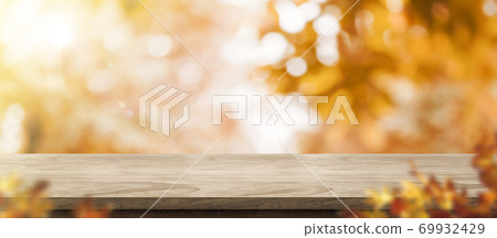 Autumn background.Empty old rustic wood table with blur forest tree with sunlight,Autumn fall backdrop, banner for product display for advertise on online,thanksgiving concept Autumn background.Empty old rustic wood table with blur forest tree with sunlight,Autumn fall backdrop, banner for product display for advertise on online,thanksgiving concept 69932429