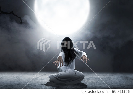 Scary ghost woman crawling with night scene background 69933306