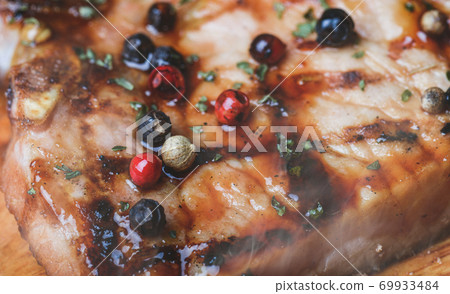 Grilled pepper pork steak with seasoning. Grilled pepper pork steak with seasoning. 69933484